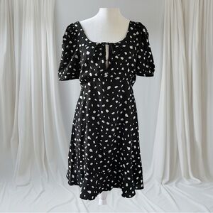 Crescent short sleeve black dress with white dot pattern